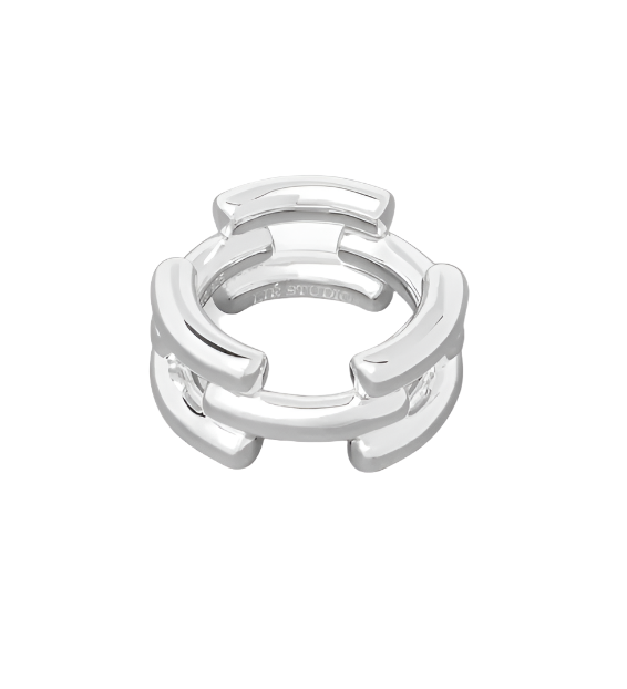 The LIÉ STUDIO Emily Ring by Lie Studio is a stunning statement piece featuring an interlocking geometric design, crafted in silver with a smooth finish and adorned with elegant 18-carat gold-plated accents.