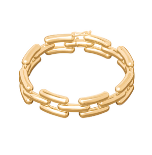 The LIÉ STUDIO Freya Bracelet by Lie Studio is a gold-plated piece featuring a clasp and oval-shaped links connected in a chain pattern, reminiscent of a vintage wristwatch.