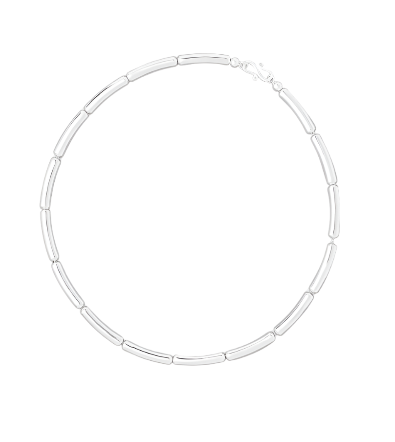 The LIÉ STUDIO Margaret Necklace by Lie Studio is a silver chain necklace with elongated, cylindrical links and a sculptural lock, featuring a lobster claw clasp.