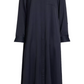 The TWP Jenny's Coated Linen Gown by TWP is a full-length, navy blue long sleeve shirtdress featuring a point collar, front button closure, and a single chest pocket.