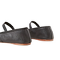 Rear view of Loeffler Randall Leonie Soft Ballet Flats in black calf leather, featuring elastic straps, a padded footbed, and wooden soles, isolated on a white background.