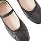 The Loeffler Randall Leonie Soft Ballet Flat by Loeffler Randall is a pair of black ballet flats adorned with ribbon ties on the front, crafted from supple calf leather and featuring beige insoles with a padded footbed.