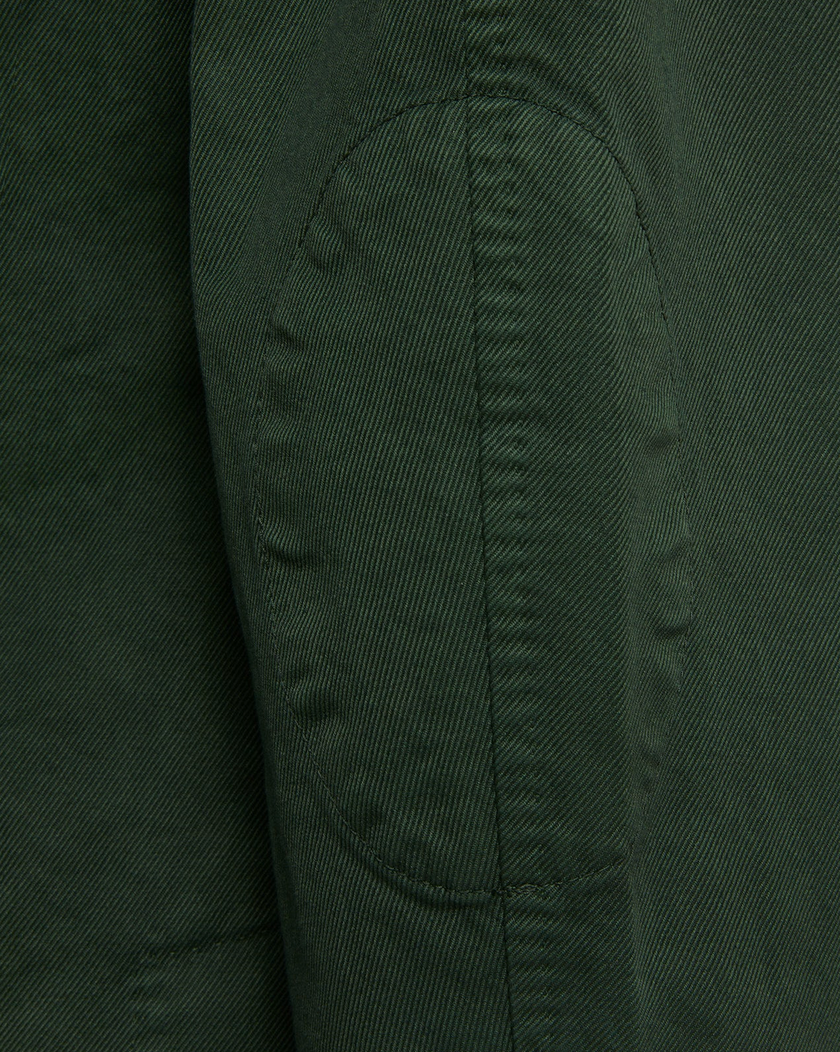 Close-up view of the Sid Mashburn Butcher Jacket in green, featuring a stitched elbow patch crafted from Italian canvas, highlighting its fine texture and seams.