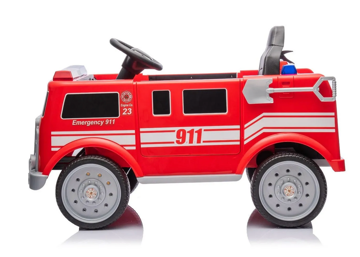 The Freddo Fire Truck is a red ride-on with "911" and "Emergency 911" on the sides, black windows, silver wheels, steering wheel, and interactive features—an ideal hero toy for kids’ imaginative play.