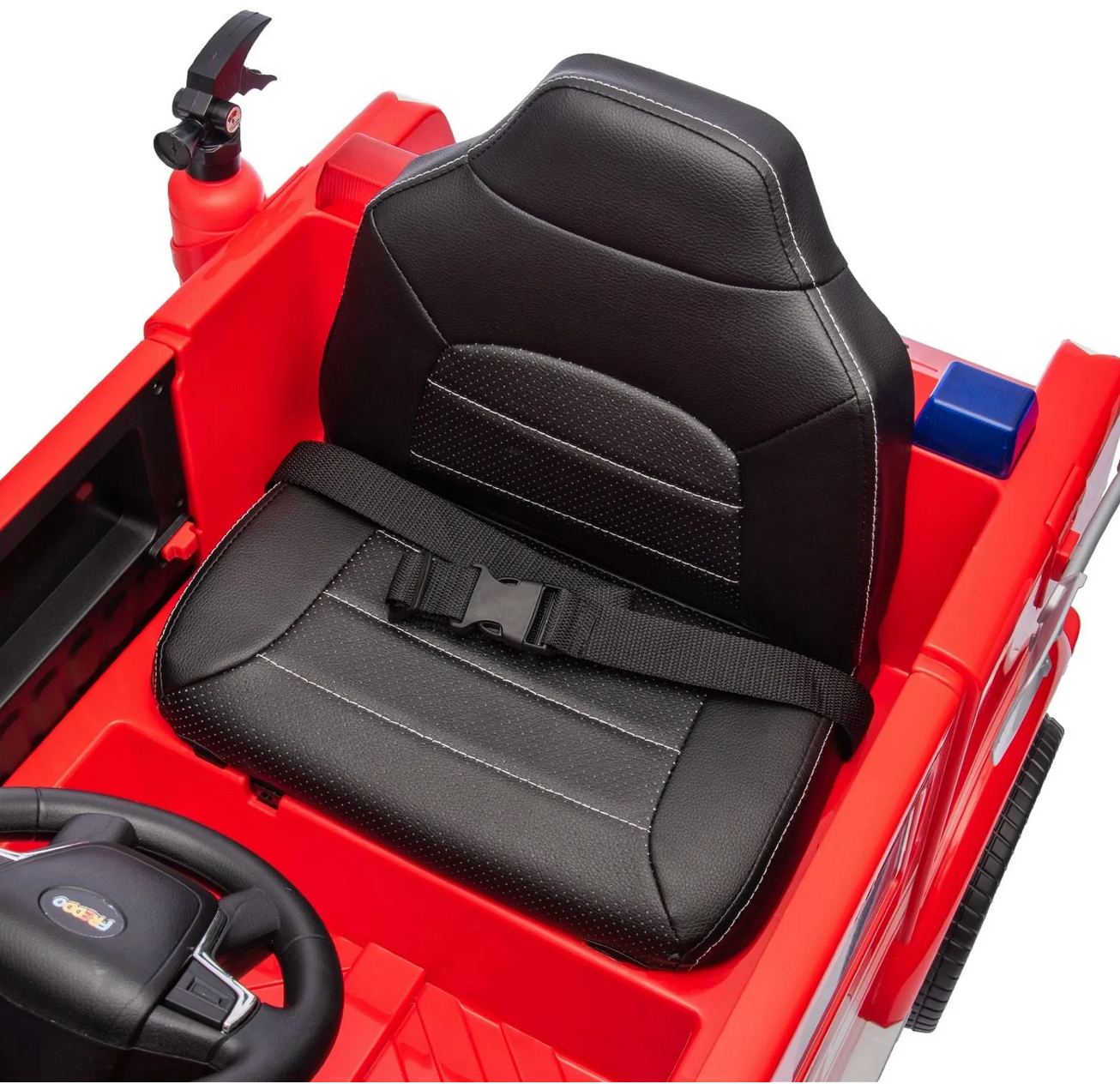 A close-up of the black seat with seatbelt inside the Freddo Fire Truck ride-on, featuring part of the steering wheel and dashboard—a perfect toy for aspiring young heroes.