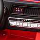 Close-up of a Freddo Fire Truck dashboard featuring control buttons, a USB port, indicator lights, and an interactive display screen—just like those in the ride-on toy.