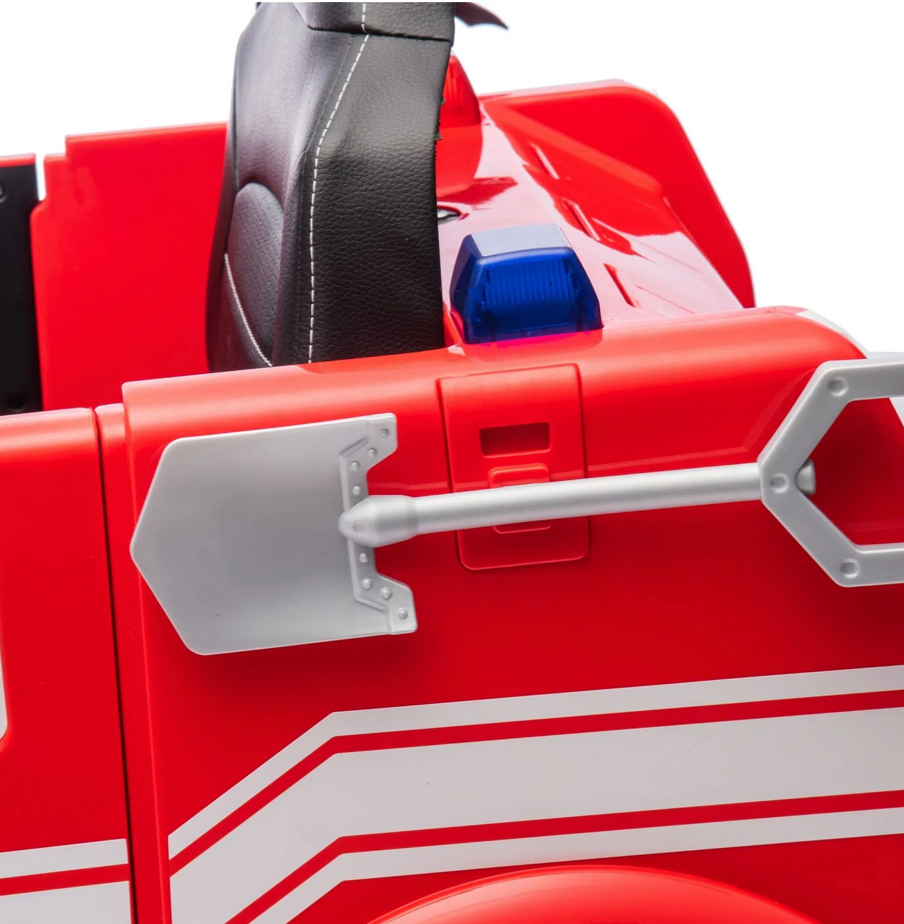 A close-up of the Freddo Fire Truck ride-on toy for kids, featuring a red body, black seat, white stripes, a silver shovel, blue emergency light, and interactive features.