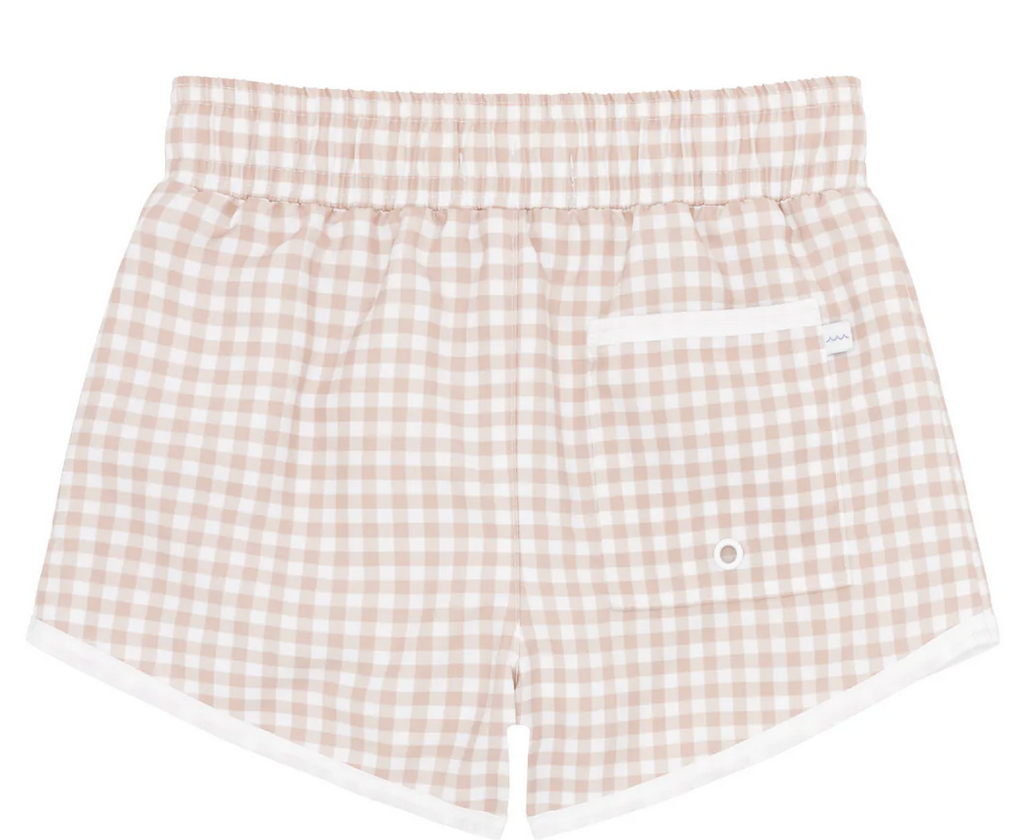 The Minnow Boy's Boardie shorts by Minnow provide boys with style, comfort, and mobility, featuring an elastic waistband and a back pocket in a beige and white gingham checkered pattern.