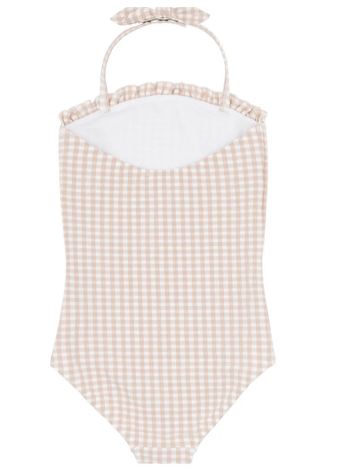 The Minnow Girls Halter One Piece with Tie Knot showcases a beige and white gingham pattern, complete with ruffled trim and adjustable halter ties. Its textured fabric offers a stylish flair, making it an ideal choice for sunny beach days.