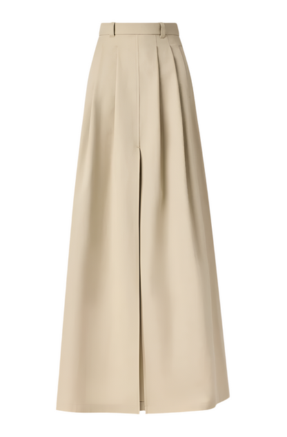 Introducing the Altuzarra Mack Skirt: an Italian-made, high-waisted beige maxi skirt featuring elegant box pleats, belt loops, and a chic front slit.