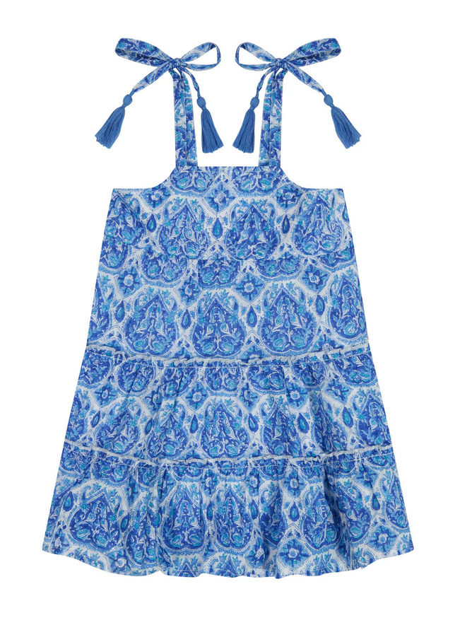 The Mer St Barth Bella Girls' Shoulder Tie Sundress by Mer features a blue and white paisley pattern with tassel shoulder ties, perfect for a summer classic look.