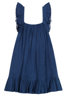 The Mer St Barth Mini Eva Girls Ruffle Dress by Mer is a charming sleeveless blue dress crafted from cotton gauze, featuring delightful ruffled straps and hem.