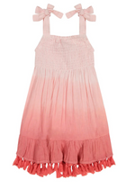 The Mer St Barth Maya Girls Sundress by Mer is a pink ombre smocked sundress featuring shoulder ties with bow details and a flouncy hem.