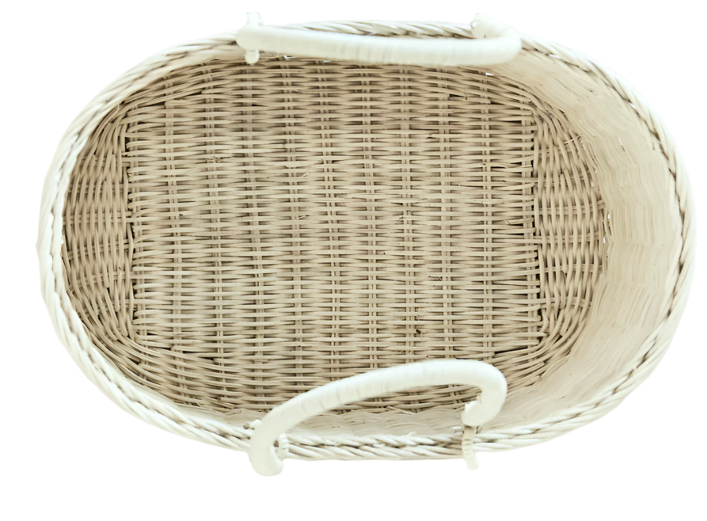 Top view of a BSavannah Diaper Caddy by Bebe Bask, an eco-friendly, oval-shaped rattan wicker basket with two handles in a natural light color. Ideal for diaper storage or household organization.