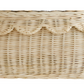 The Bebe Bask Floral Rattan Scallop Basket is a beautiful woven wicker basket with a decorative edge, ideal for organizing nursery essentials.