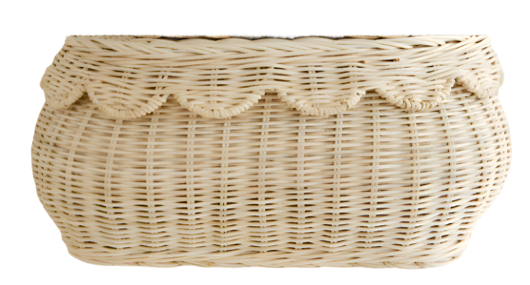 The Bebe Bask Floral Rattan Scallop Basket is a beautiful woven wicker basket with a decorative edge, ideal for organizing nursery essentials.