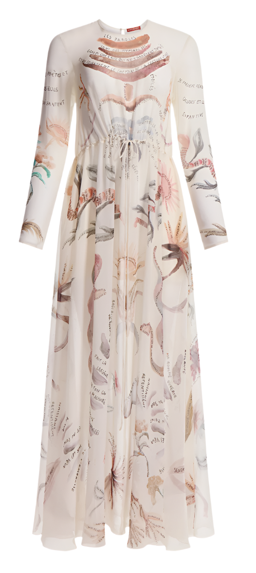 The Altuzarra Sybbeline Dress is a long-sleeved sheer silk gown with a sophisticated high collar and maxi hem, adorned with intricate botanical illustrations resembling delicate tattoos.