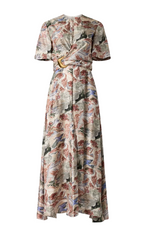 The Honey Dress by Altuzarra is a short-sleeved, ankle-length silk dress with an artistic landscape print in muted tones and a gathered waist detail.