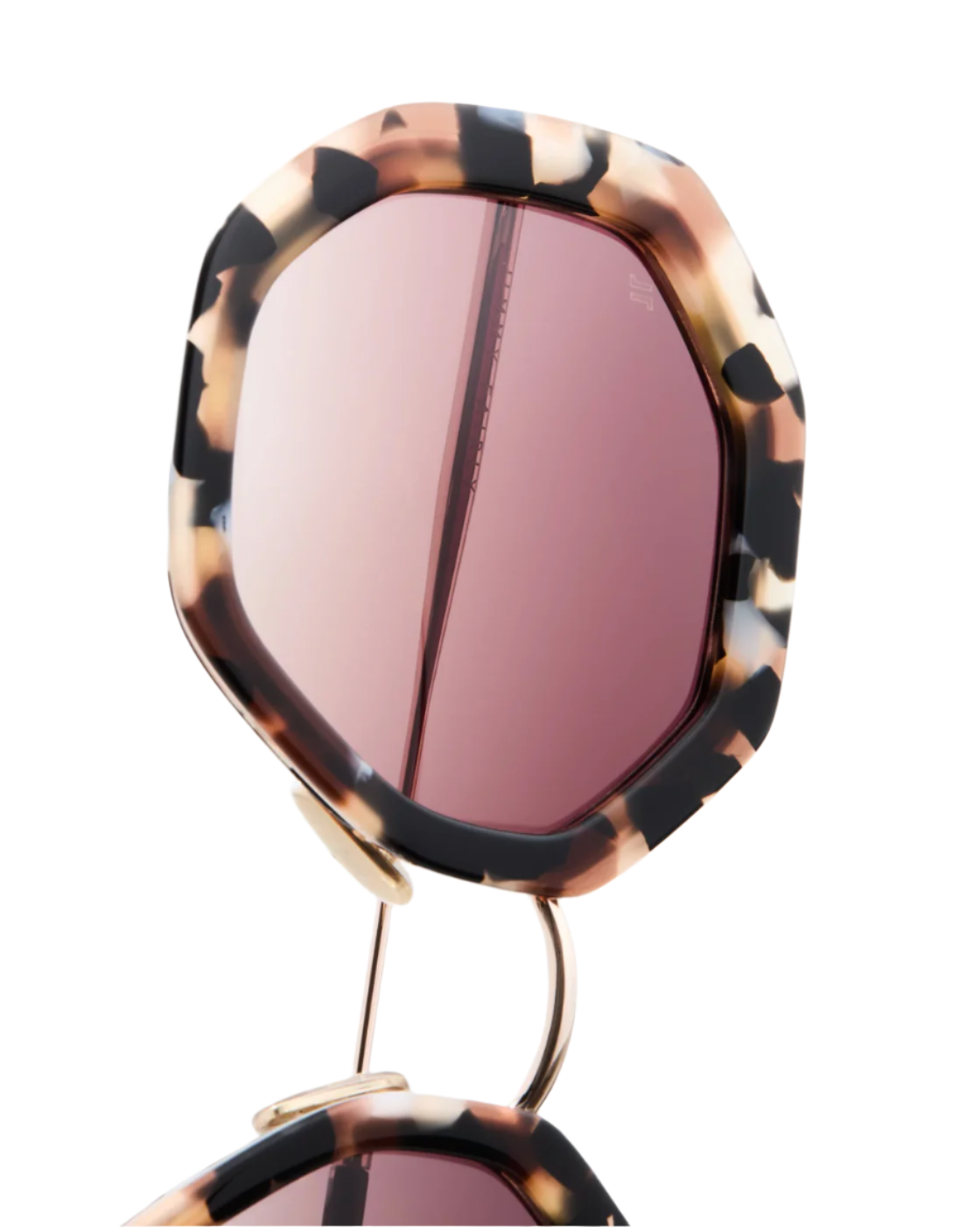 Close-up of Angie Sunglasses by Jimmy Fairly, featuring a geometric hexagonal frame in tortoiseshell-patterned acetate with pink-tinted lenses, shown against a white background.