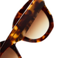 Close-up of Jimmy Fairly Swirl Sunglasses, featuring a tortoiseshell butterfly frame made from cellulose acetate and brown gradient lenses, shown against a white background.