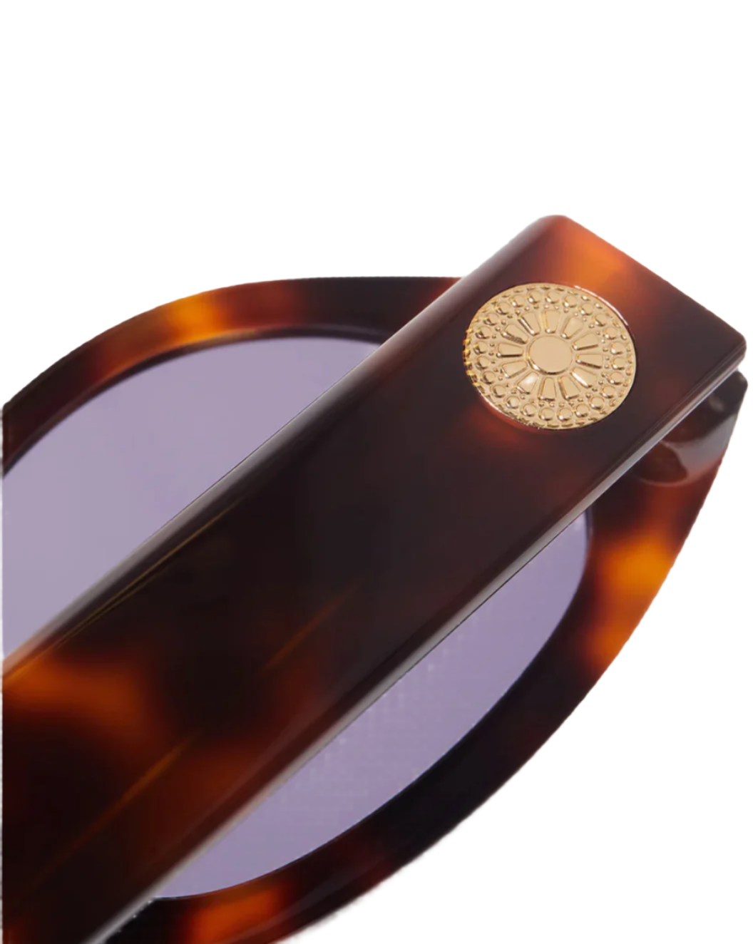 Close-up of the arm of the Jimmy Fairly Meli Icons Sunglasses, showcasing a cellulose acetate tortoiseshell-pattern with a gold medallion and purple lenses.