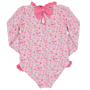 The Beaufort Bonnet Company's Baby Girls and Girls' Sarasota Surf Suit features a pink floral print, lace trim, and a big back bow—offering sweet style and sun protection.
