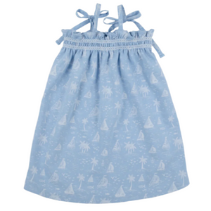 The Girls' Laineys Little Dress by The Beaufort Bonnet Company is light blue with thin shoulder ties and a charming white tropical print featuring palm trees, sailboats, and waves in the Bay Side Blue shade.