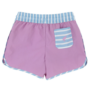 The Beaufort Bonnet Company’s Baby Boys' and Boys' Tanner Trunks feature a pink design, light blue and white striped waistband, striped side trim, and a back pocket with flamingo embroidery—ideal for young fans of classic swim style.