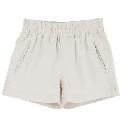 The Beaufort Bonnet Company Baby Boys' and Boys' Prepletic™ Sheffield Shorts in beige, featuring an elastic waistband and two slanted front pockets, are shown on a plain white background.
