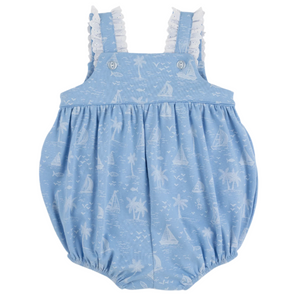The Beaufort Bonnet Company's Baby Girls' Babs Bubble is a light blue cotton romper with white Bay Side Boats and palm tree print, ruffled straps, and elastic leg openings.