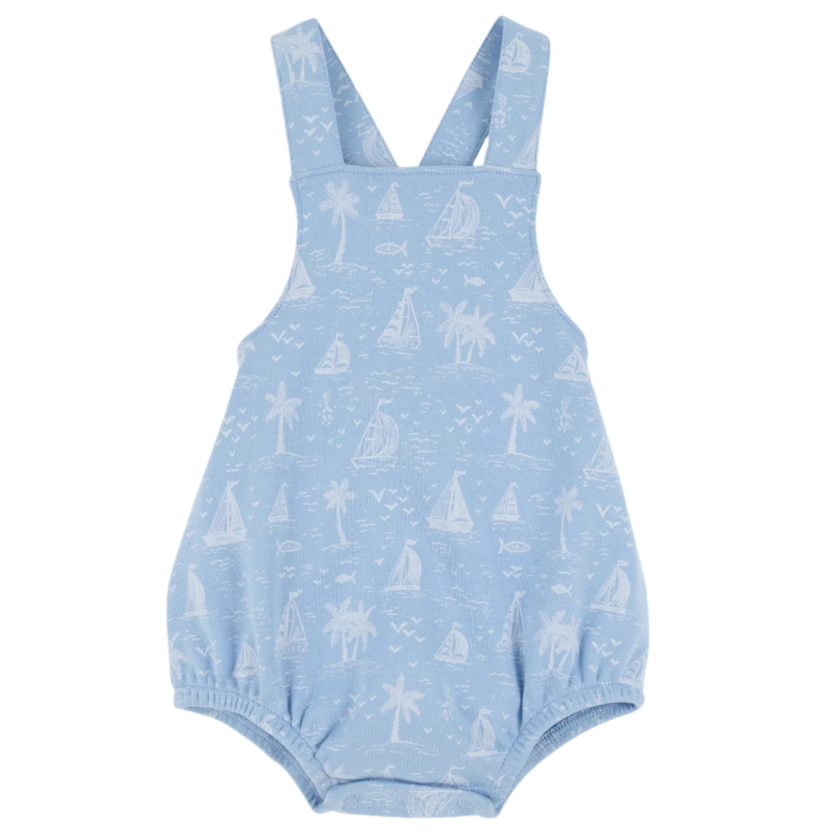The Beaufort Bonnet Company Baby Stillman Sunsuit is a light blue romper with white sailboats, palm trees, and fish prints, featuring shoulder straps and elastic leg openings in the brand’s classic style.