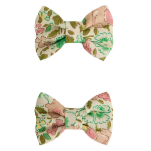 Two Miniclic Hair Clips by Bonpoint, crafted from pale pink Liberty fabric with a delicate floral print, displayed on a white background.