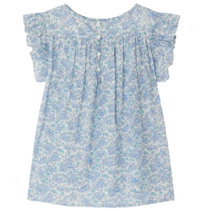 The Bonpoint Girls' Fidji Smocked Blouse, made with Liberty Fabrics, features a light blue floral pattern, short ruffled sleeves, white front buttons, and delicate hand-embroidered smocking for extra charm.