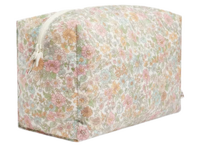 The Bonpoint Coated Pouch, made with pink Liberty fabric, features a pastel floral print and a white zipper—perfect for carrying baby’s essentials.