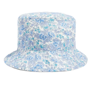 The Piob Hat Made with Liberty Fabric by Bonpoint features a wide brim and a blue and white floral print on white, shown against a plain white background.