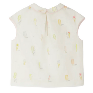 The Bonpoint Girls' Elivia Blouse features a sleeveless cream design with pastel ice-cream motifs and a small back button.