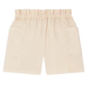 Bonpoint Girls' Evera Shorts in Denim, shown in beige with an elastic gathered waistband and two side pockets, are crafted from lightweight denim for comfort and style.