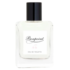A clear 100ml glass bottle of Bonpoint Eau de Toilette with a black cap and white label showcases the brand name, embodying a delicate floral scent.