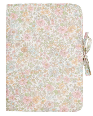 The Ebbi Health Book Cover by Bonpoint features pink Liberty fabric with a pastel floral pattern and a right-side bow closure, making it the perfect quilted cover for a child's health record.