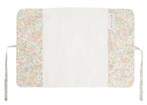The Bonpoint Ebbi Health Book Cover features Pink Liberty floral fabric sides, a plain white center, and two fabric ties on each end.