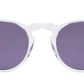 The Noto round sunglasses by Jimmy Fairly feature clear plastic frames made from lightweight acetate and dark purple lenses, shown against a white background.