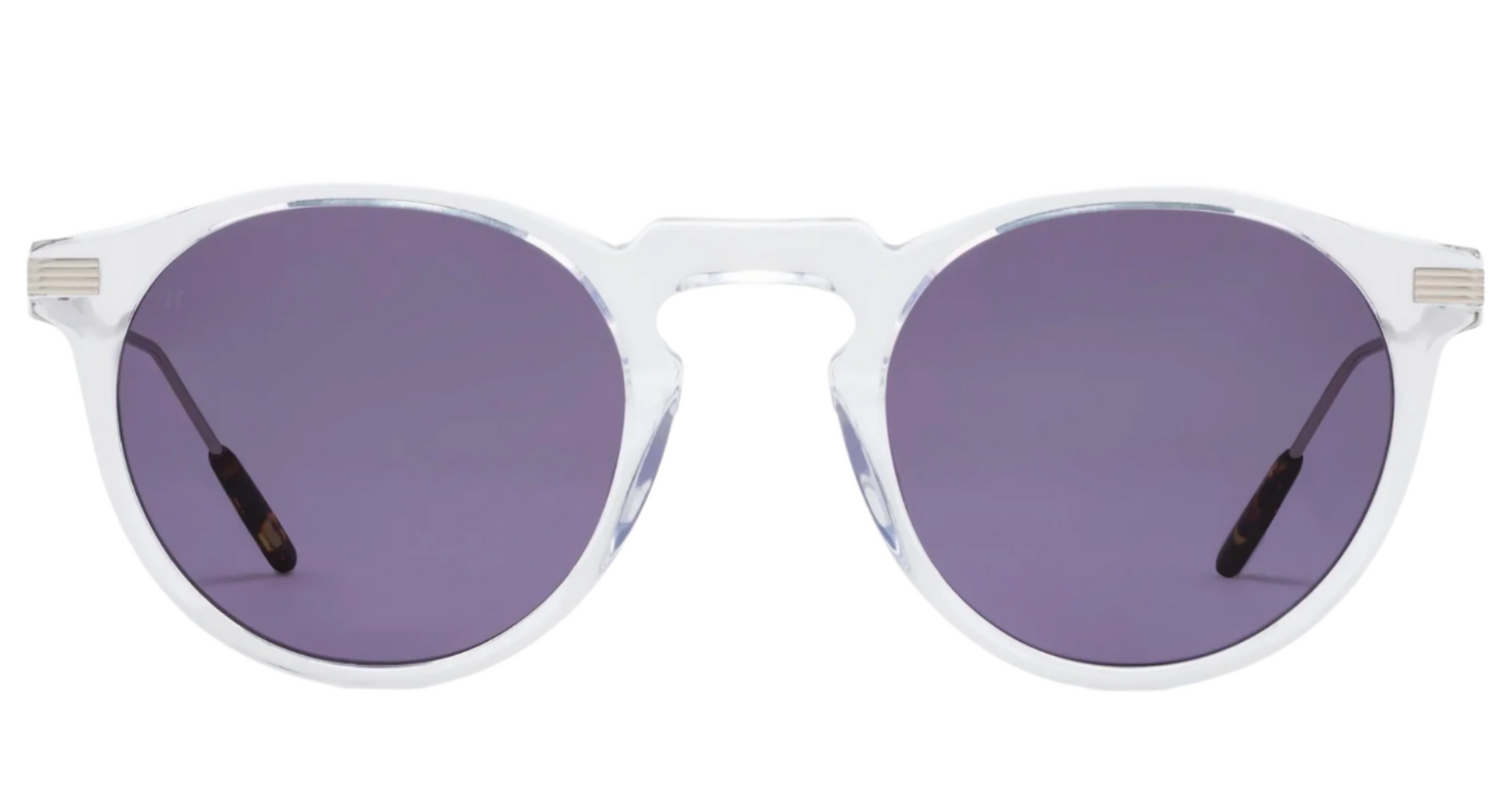 The Noto round sunglasses by Jimmy Fairly feature clear plastic frames made from lightweight acetate and dark purple lenses, shown against a white background.