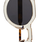 Close-up of The Hometown round sunglasses by Jimmy Fairly, featuring a clear cellulose acetate frame and dark lenses, partially folded against a white background.