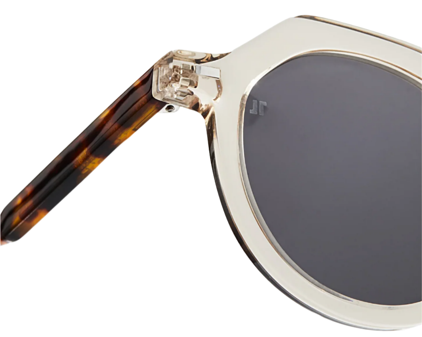 Close-up of The Hometown sunglasses by Jimmy Fairly, featuring clear beige cellulose acetate frames, dark lenses, and a tortoiseshell-patterned temple arm.