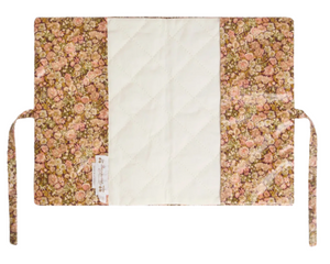 The Ebba Health Record Cover by Bonpoint is crafted with Liberty Fabrics, featuring a floral pattern and a plain cream center, secured with two fabric ties for easy folding.