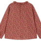The Bonpoint Girls' Gentille Smocked and Embroidered Blouse in Liberty organic cotton features a gathered neckline, ruffled collar, and a delicate pink, red, and green floral print.