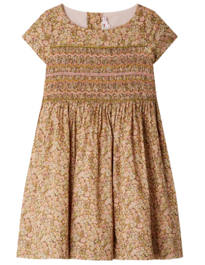 The Girls' Duchesse Smocked Dress made with Liberty Fabric by Bonpoint features short sleeves, knee-length, a gathered waist, multicolored floral print, and decorative embroidered smocking across the chest.