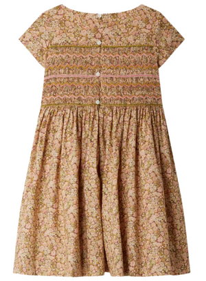The Bonpoint Girls' Duchesse Smocked Dress made with Liberty Fabric is a knee-length, short-sleeved floral dress, featuring delicate embroidered smocking and back buttons.