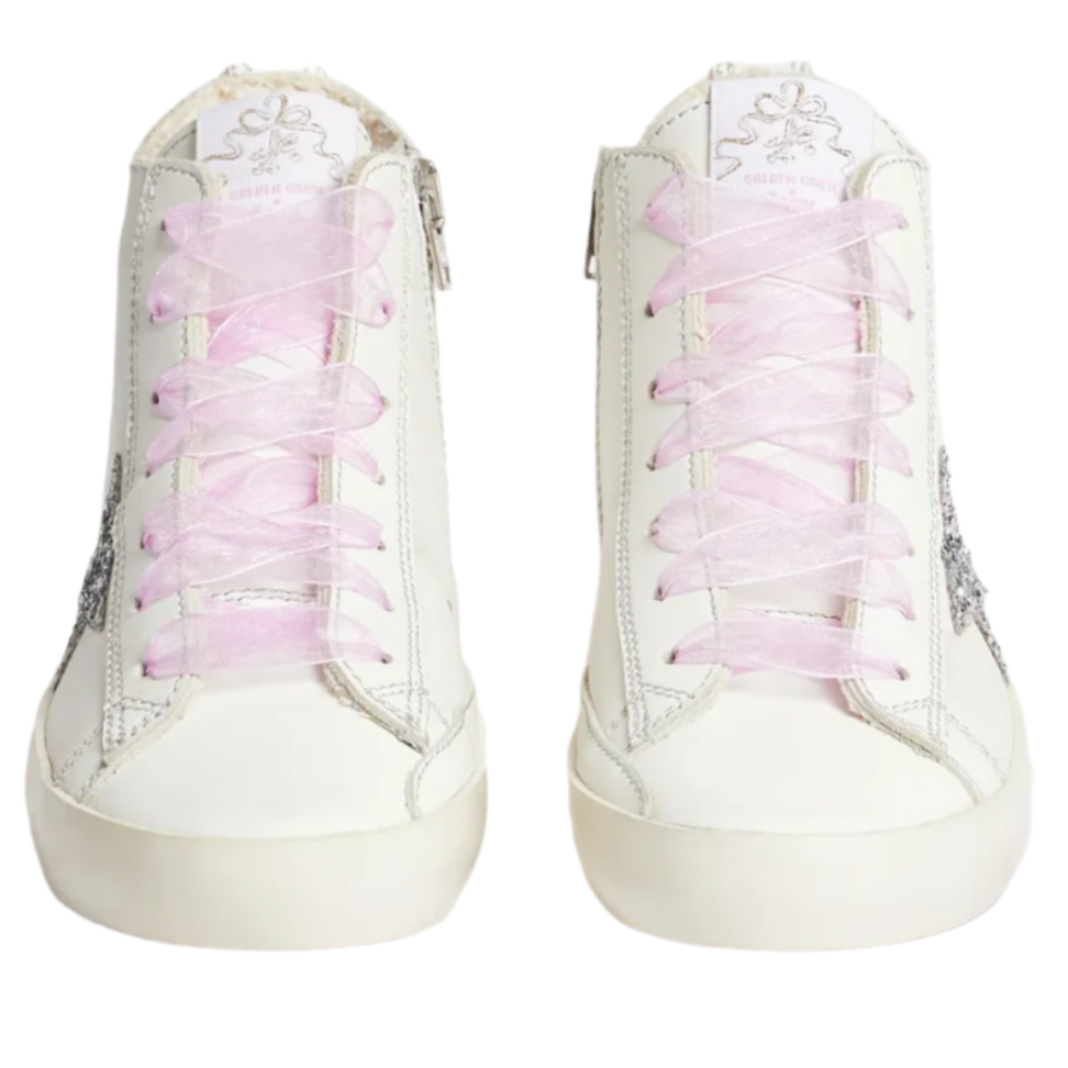 A pair of Bonpoint x Golden Goose white girls' leather high-top sneakers with pink laces, shown from the front against a plain background.