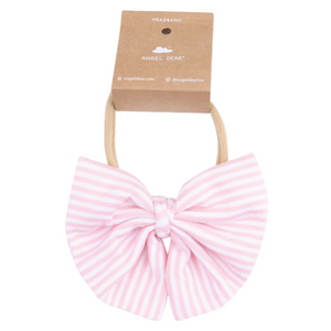 The Angel Dear Baby Golf Carts Big Bow on Soft Headband features a pink and white striped bow with a tan elastic band, perfect for cozy fall outfits, and comes attached to branded cardboard packaging.